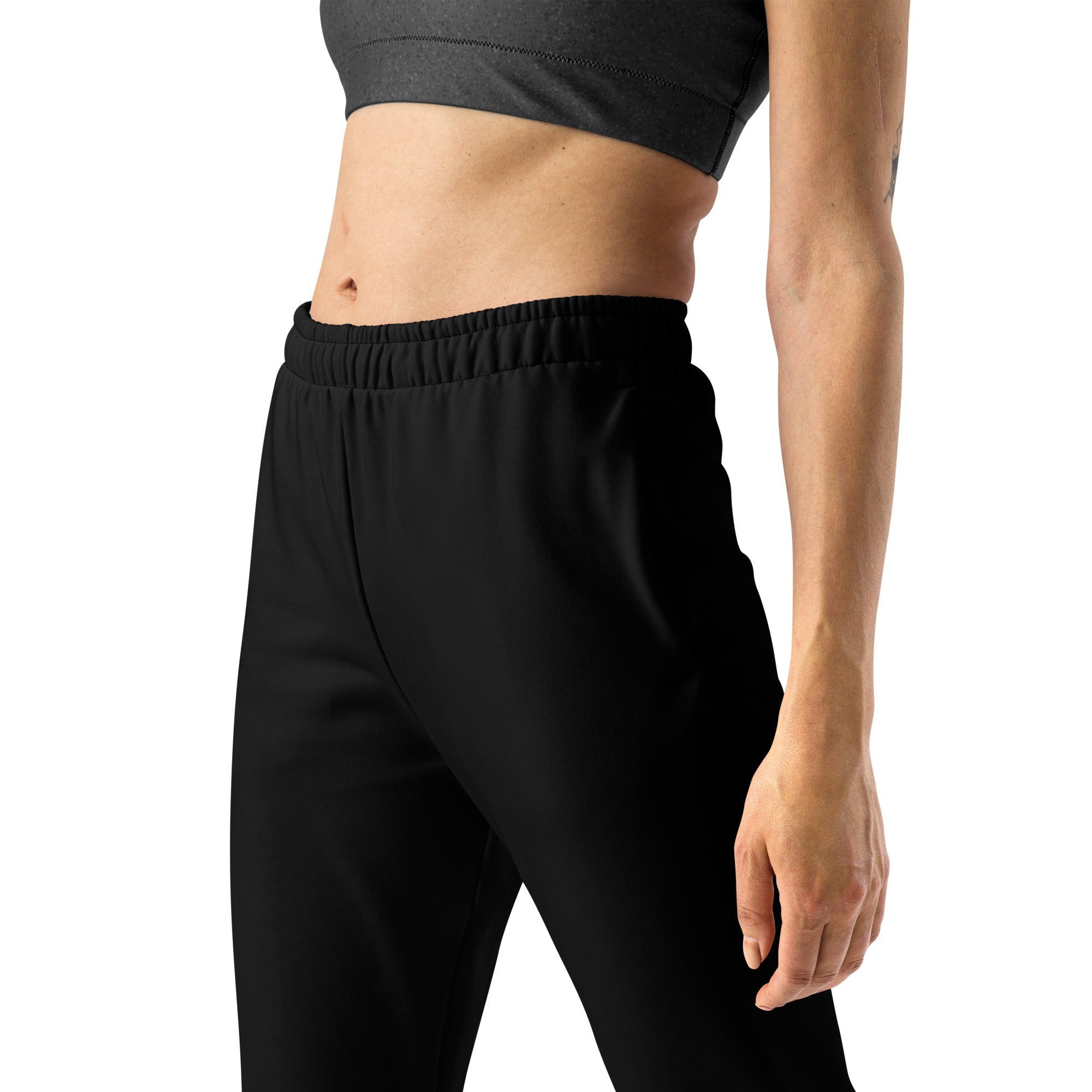 Women’s black recycled jogger pants with pockets featuring cozy brushed inside fleece and elastic waist waistband