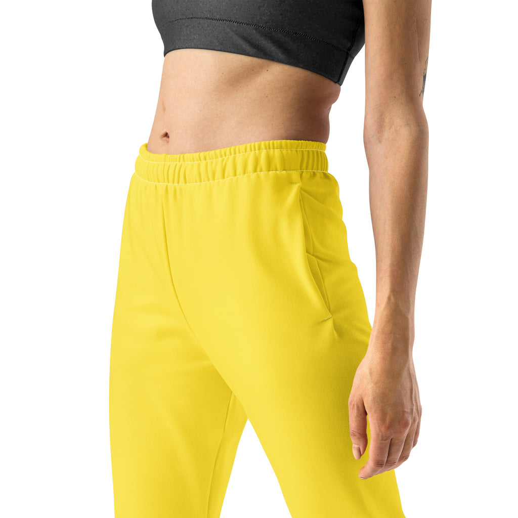 Women’s yellow recycled jogger pants with soft brushed fleece inside elastic waistband and side pockets