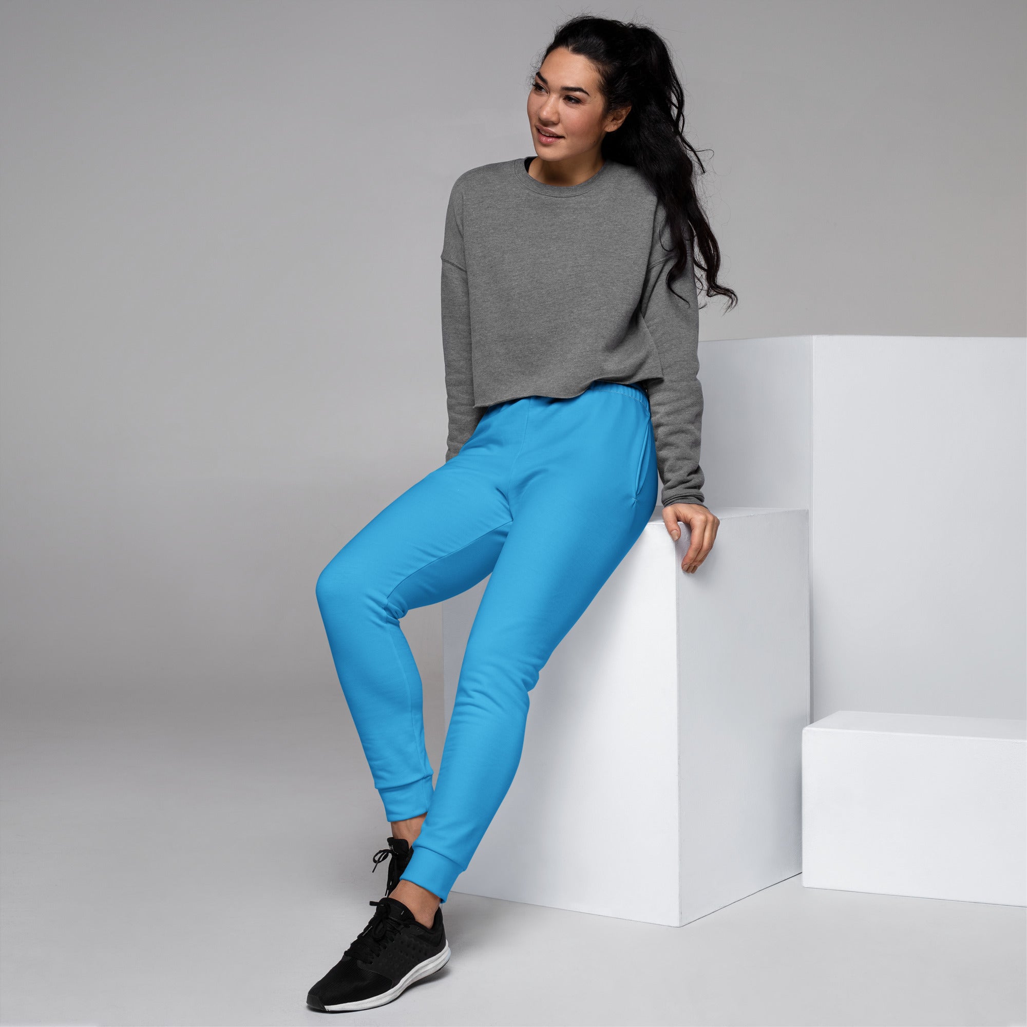 Women’s sky blue recycled jogger pants with snug fit elastic cuffs and cozy brushed inside fleece pockets
