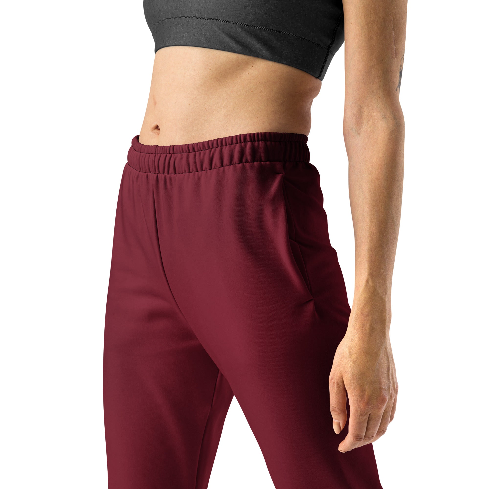 Women’s burgundy recycled jogger pants with pockets featuring a cozy brushed fleece interior and stretchy fabric
