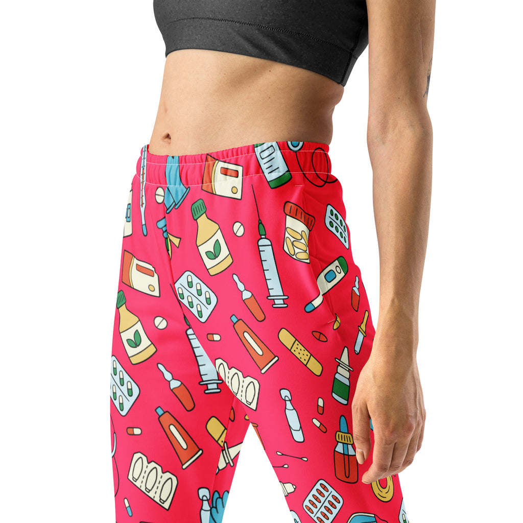 Women’s bright pink recycled jogger pants with cozy fleece inside and playful medical supplies print with pockets