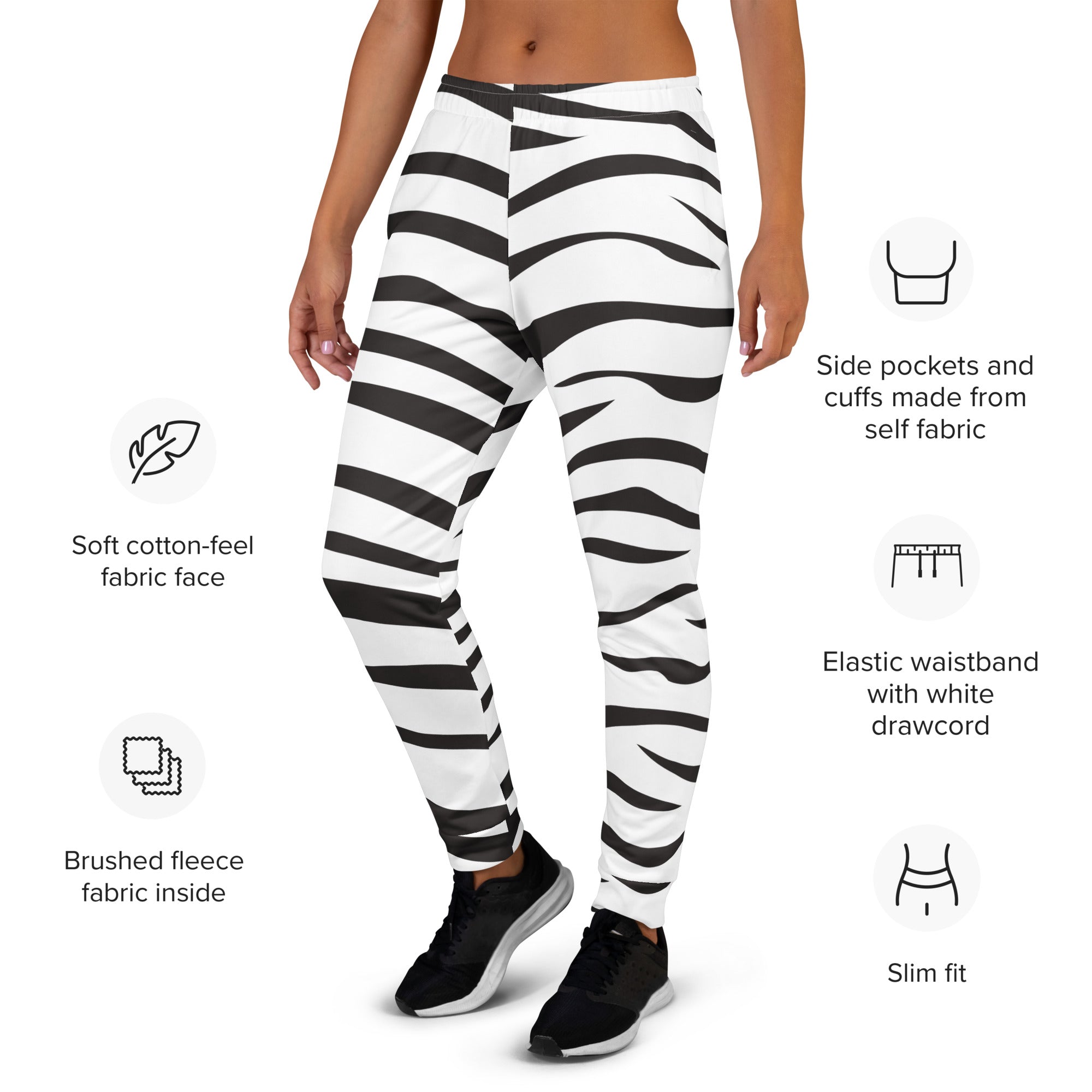 Women’s zebra print recycled jogger pants with pockets featuring black and white stripes and cozy brushed fleece lining