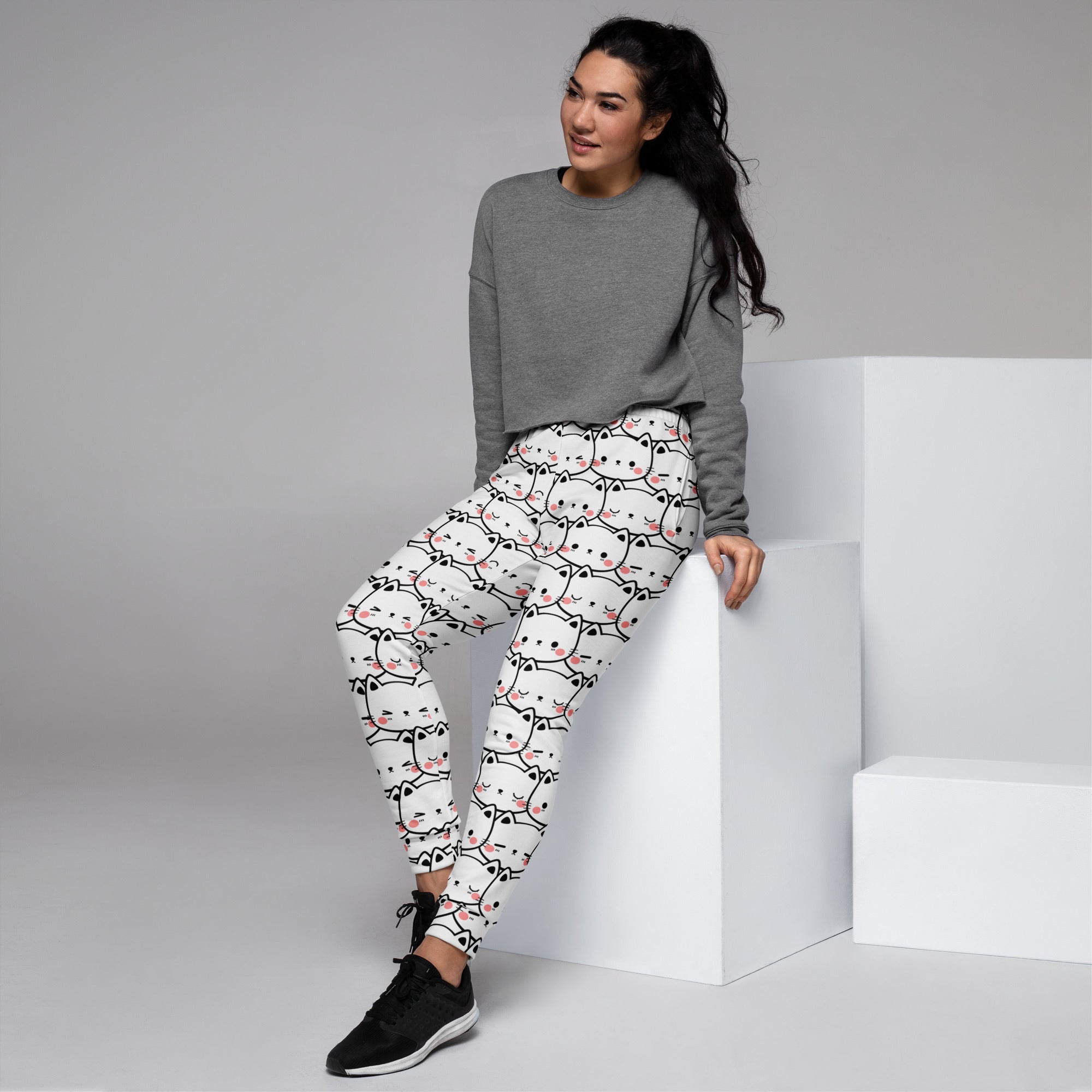 White women’s jogger pants with black outlined cat print pink blush cheeks cozy brushed fleece pockets