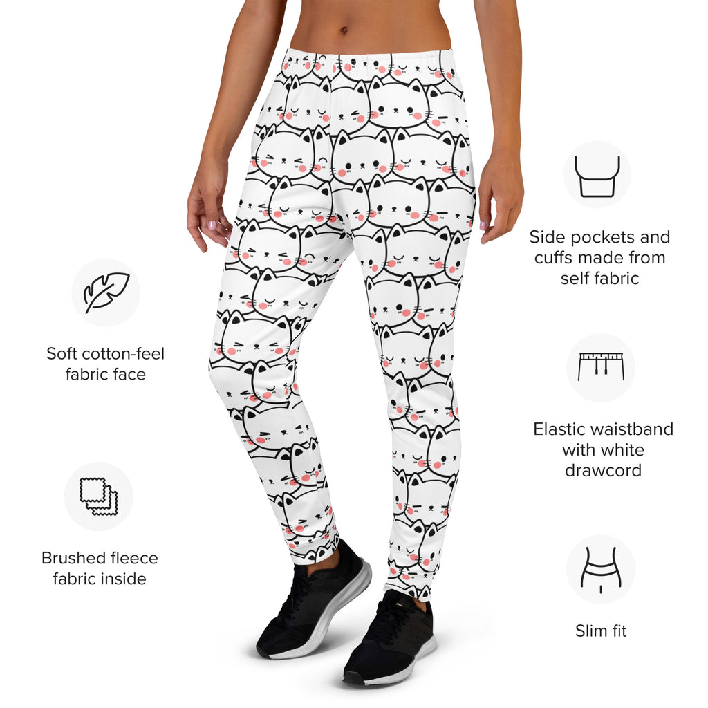 White leggings with black outlined cartoon cats and pink cheeks featuring cozy brushed fleece inside and pockets