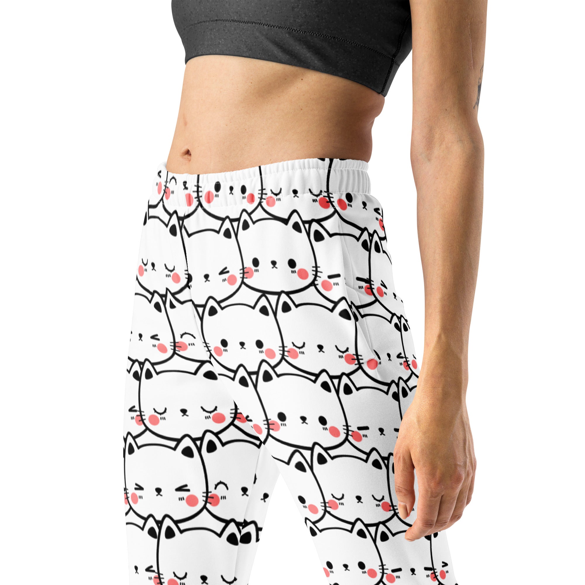 White leggings with black outlined cartoon cats and pink cheeks in cozy brushed fleece recycled jogger pants with pockets