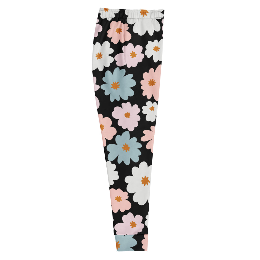 Black leggings with vibrant pink white and light blue floral pattern orange centers cozy brushed fleece inside