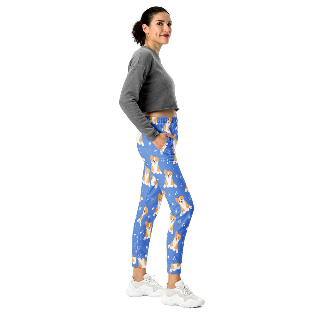 Women’s blue recycled jogger pants with cozy fleece inside featuring tan and white corgi dog pattern with stars