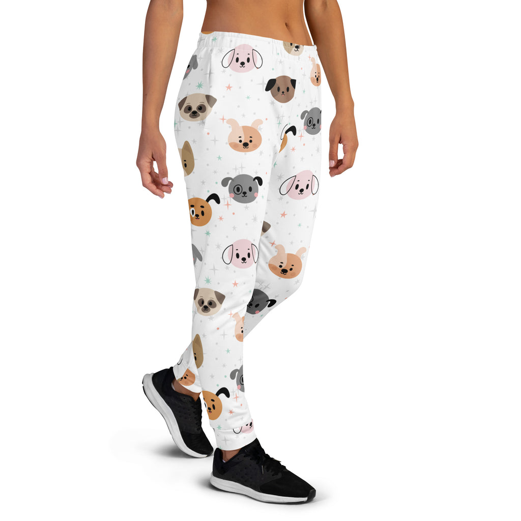 White women’s dog face recycled jogger pants with pockets featuring pastel cartoon dog faces and cozy brushed fleece inside