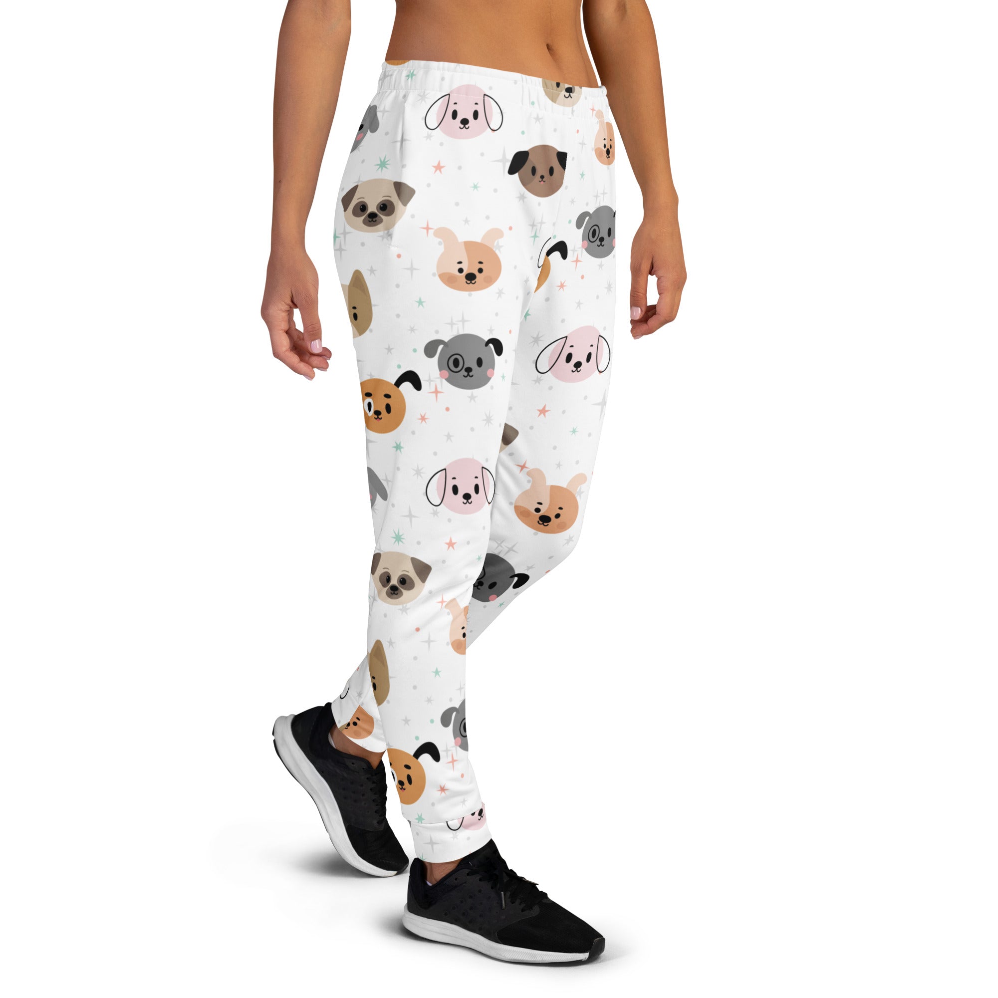 White women’s dog face recycled jogger pants with pockets featuring pastel cartoon dog faces and cozy brushed fleece inside