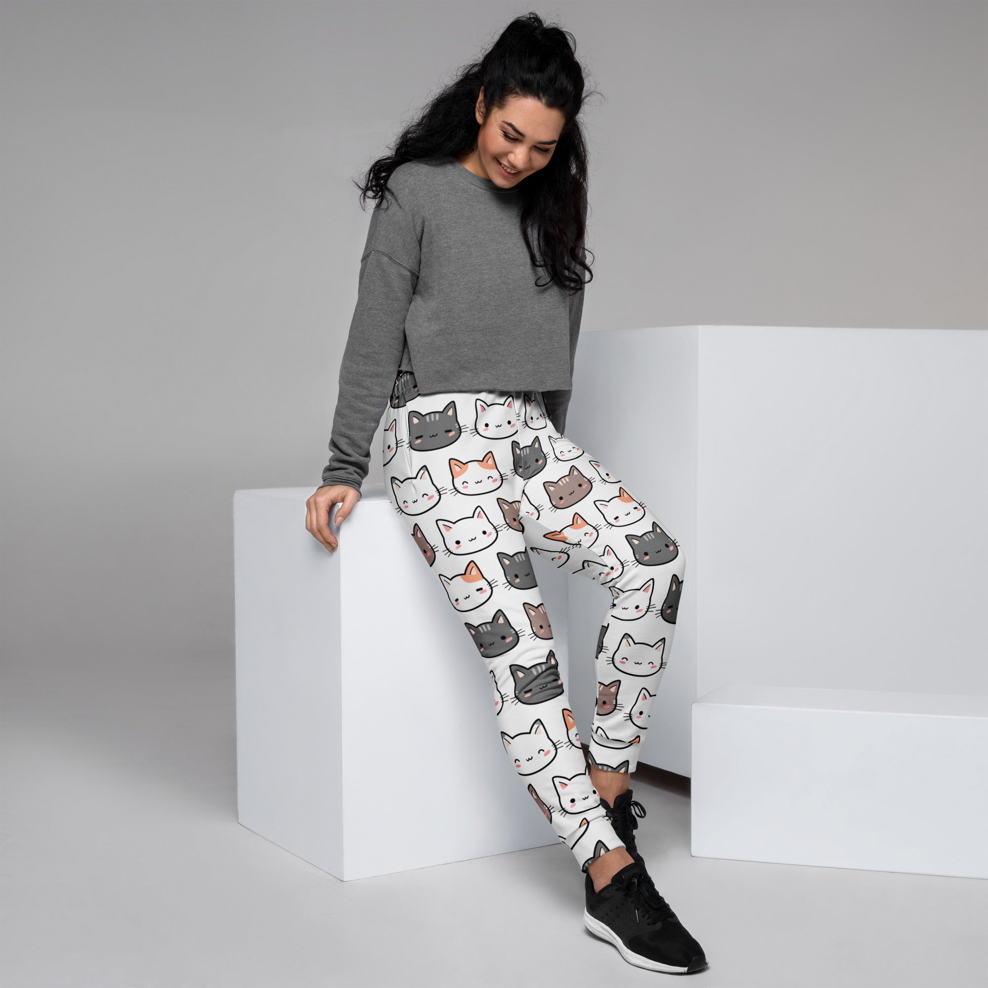 Women’s white recycled jogger pants with colorful cartoon cat faces cozy brushed fleece inside and pockets