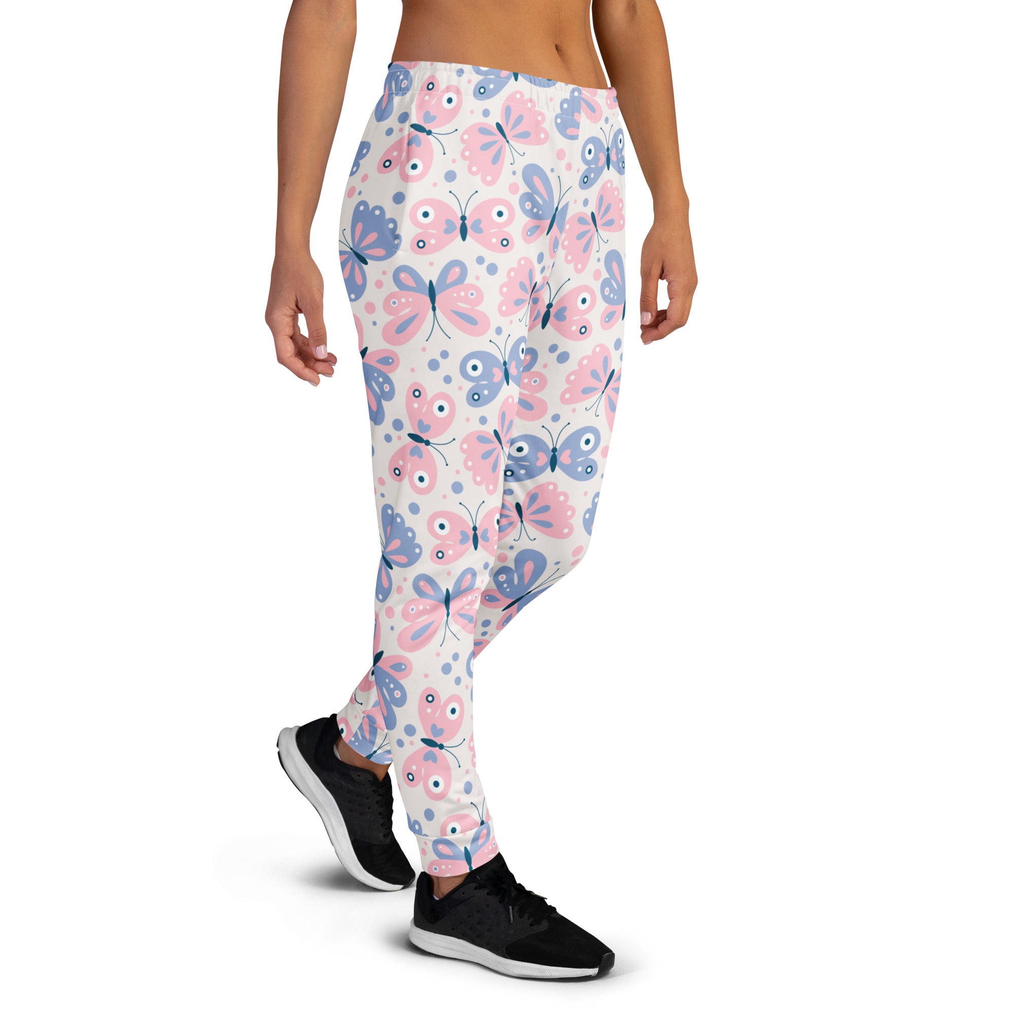 White leggings with pink and blue cartoon butterfly pattern black outlines made from cozy recycled fleece jogger pants