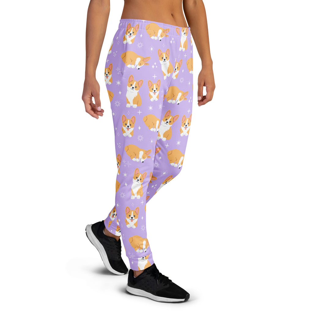 Women’s purple recycled jogger pants with cozy fleece lining featuring orange and white corgi dog pattern and star accents