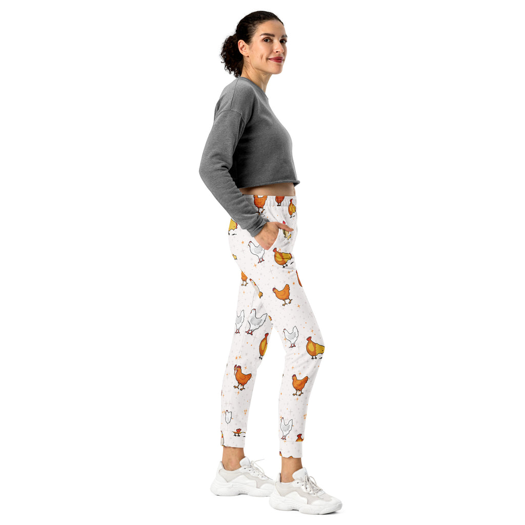 White leggings with playful orange and white chicken pattern made from cozy recycled fleece jogger fabric with pockets