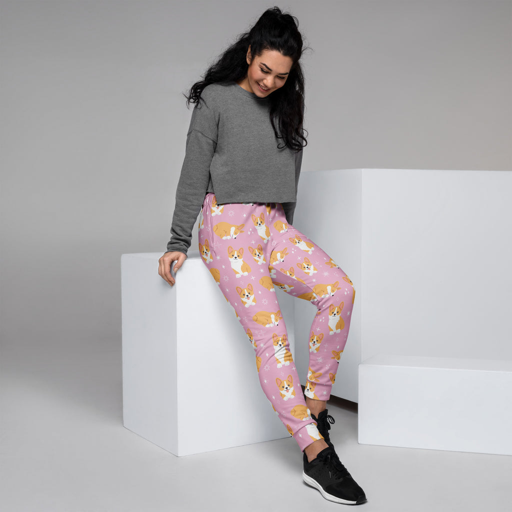 Women’s pink corgi dog jogger pants made of soft stretchy recycled fabric with cozy brushed fleece inside and pockets
