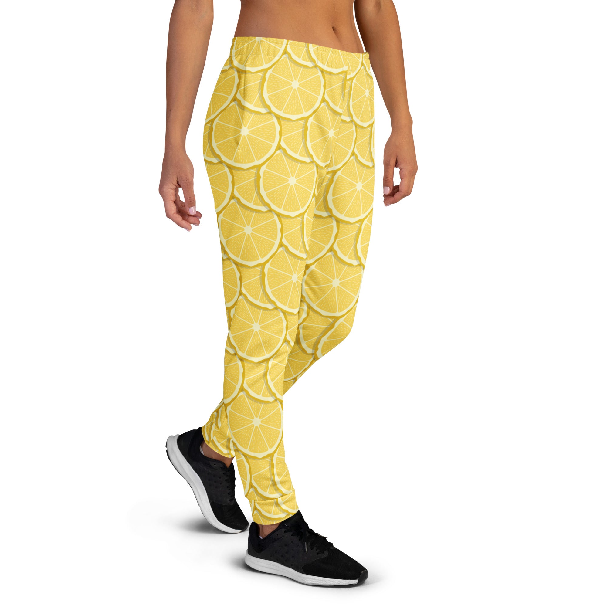 Women’s lemon slice jogger pants with pockets in yellow pattern made from cozy recycled fleece material