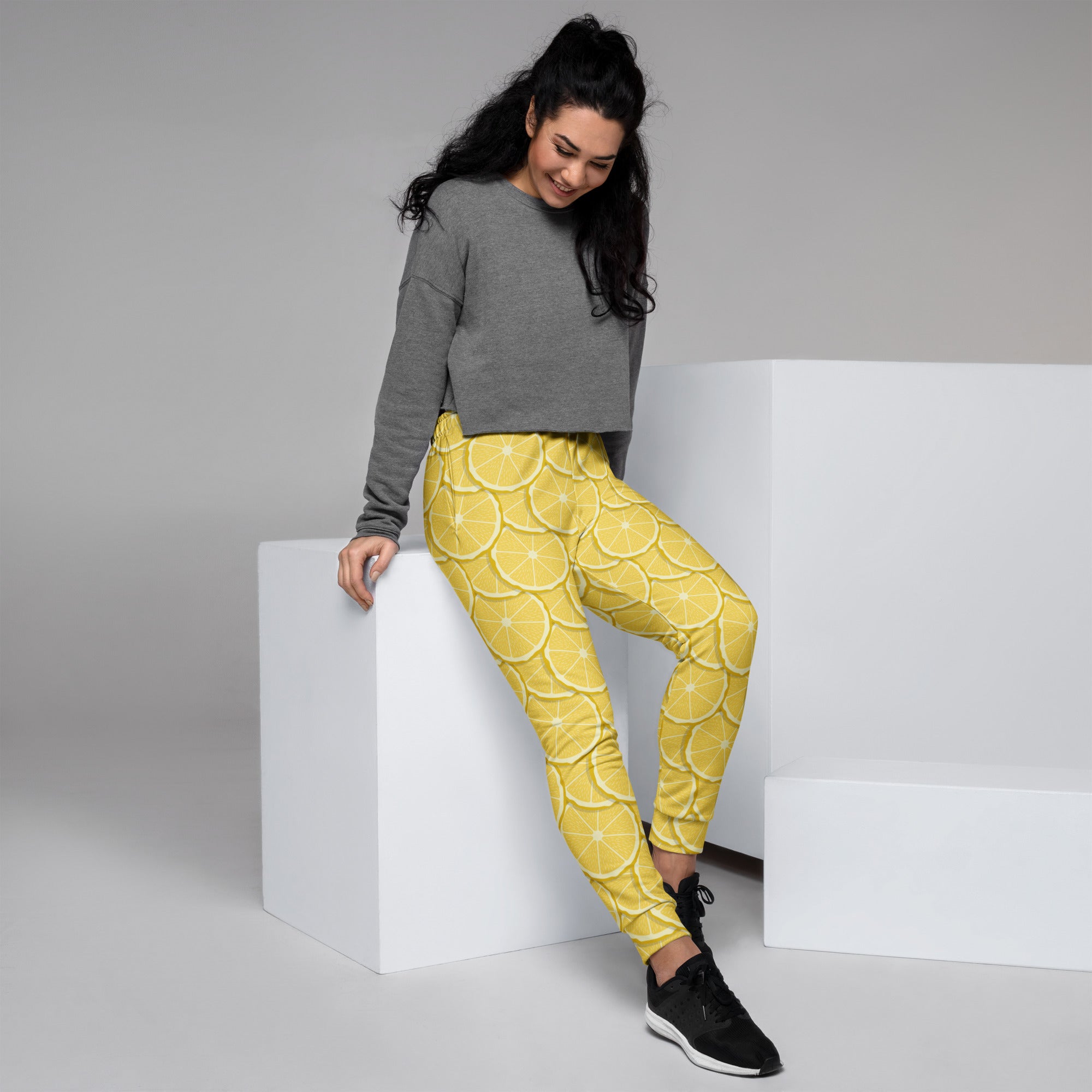 Bright yellow women’s lemon slice recycled jogger pants with pockets and cozy brushed inside fleece lining