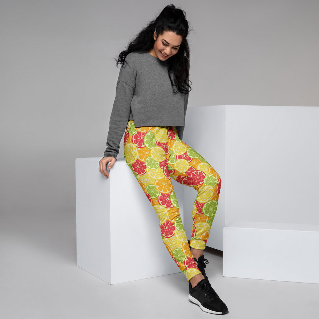 Women’s citrus slice recycled jogger pants with pockets in yellow red and green featuring cozy brushed fleece inside