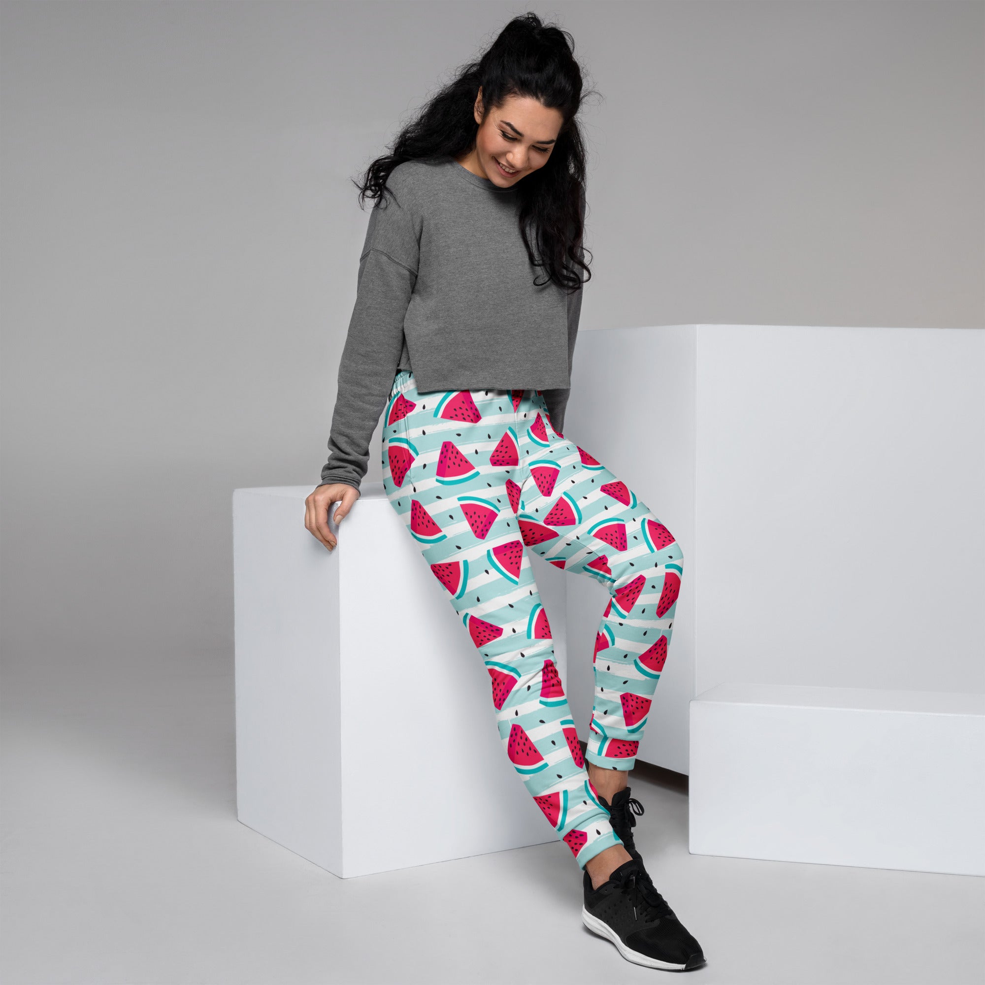 Women’s striped watermelon recycled jogger pants in vibrant pink and teal with cozy brushed fleece and pockets