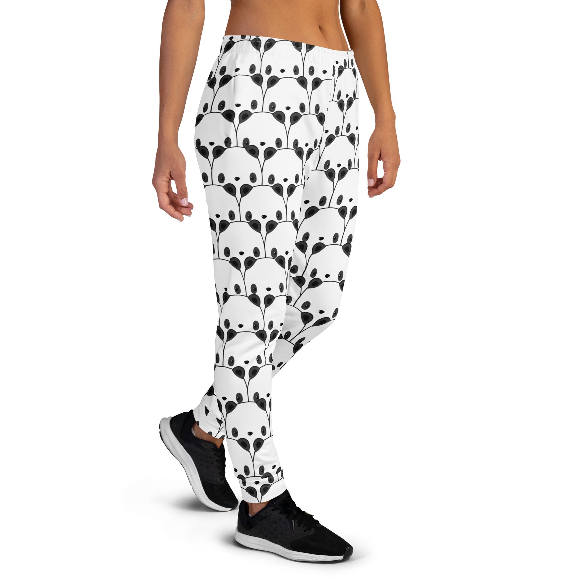 Women’s white panda recycled jogger pants with pockets featuring a black panda face pattern and cozy brushed fleece inside