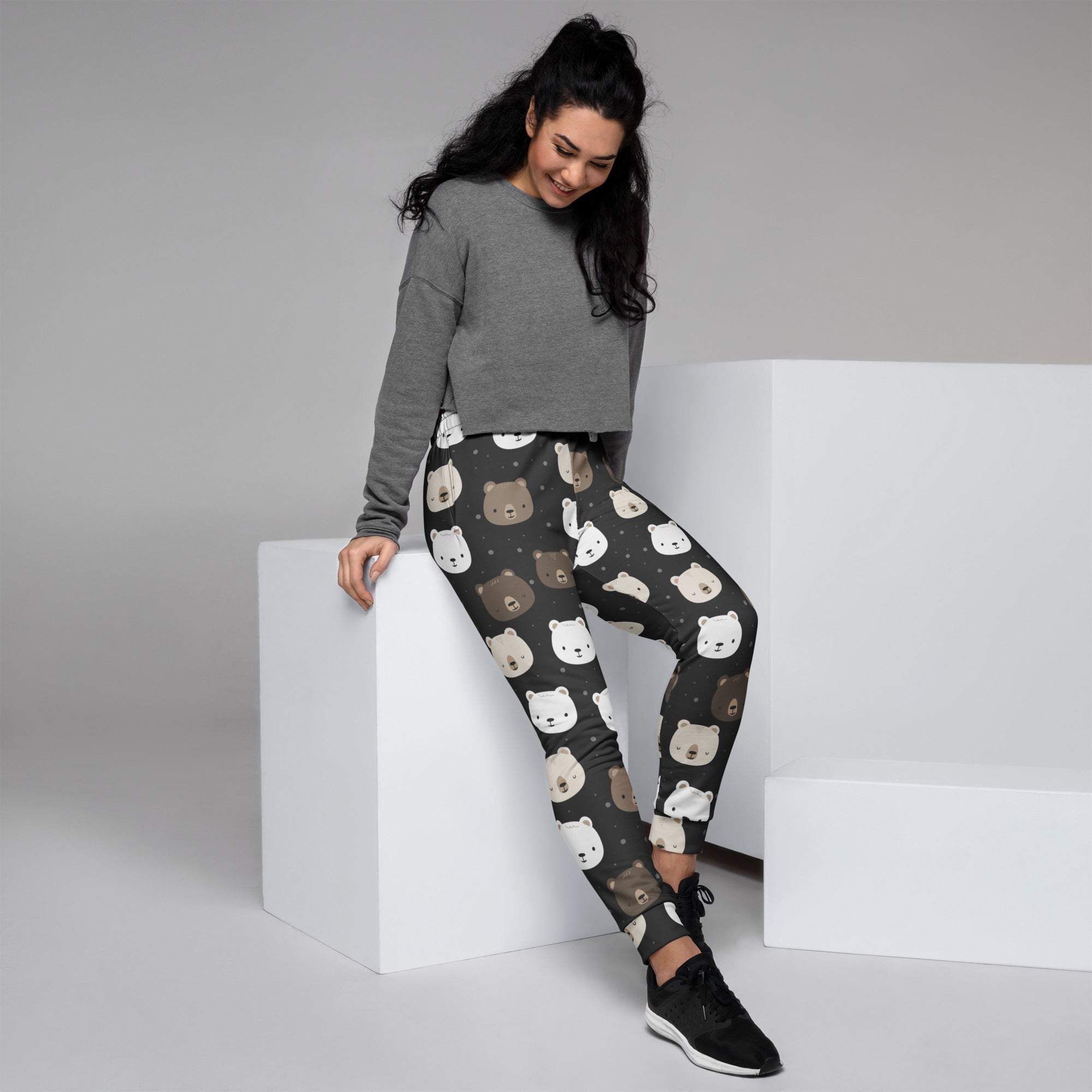 Dark gray women’s jogger pants with playful white beige and brown bear pattern cozy brushed fleece inside