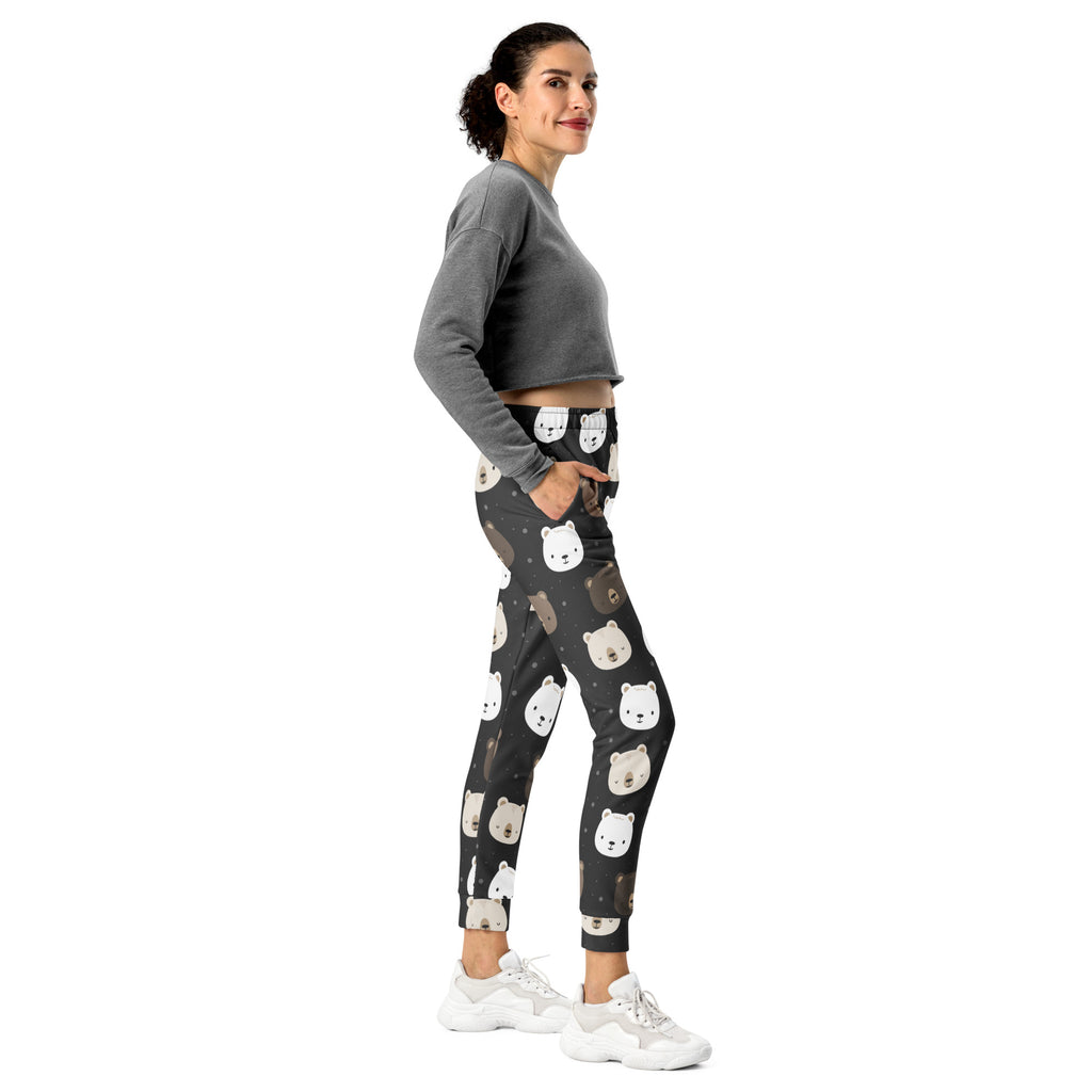 Women’s cute bear recycled jogger pants with pockets in black featuring white and beige bear faces and cozy fleece lining