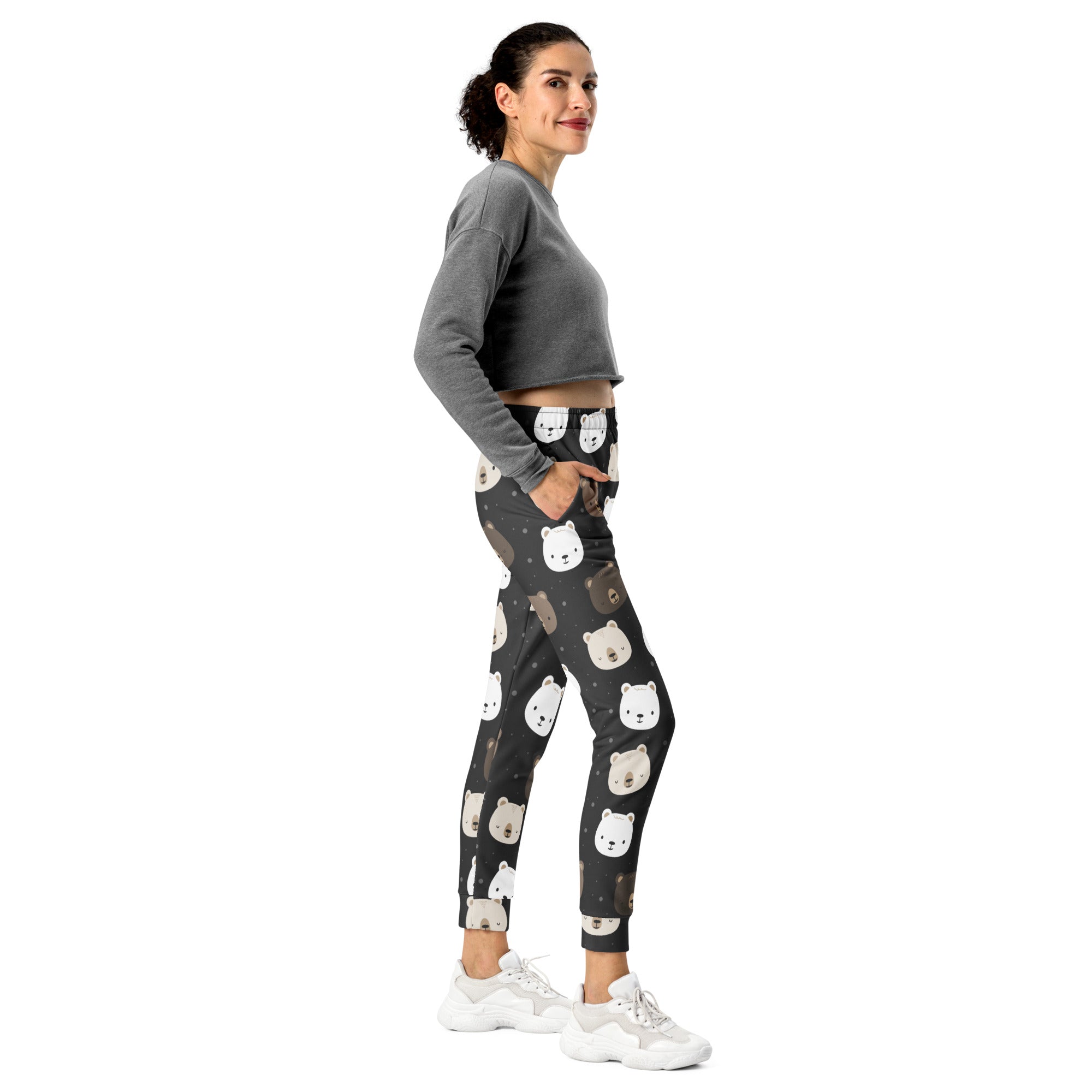 Women’s cute bear recycled jogger pants with pockets in black featuring white and beige bear faces and cozy fleece lining