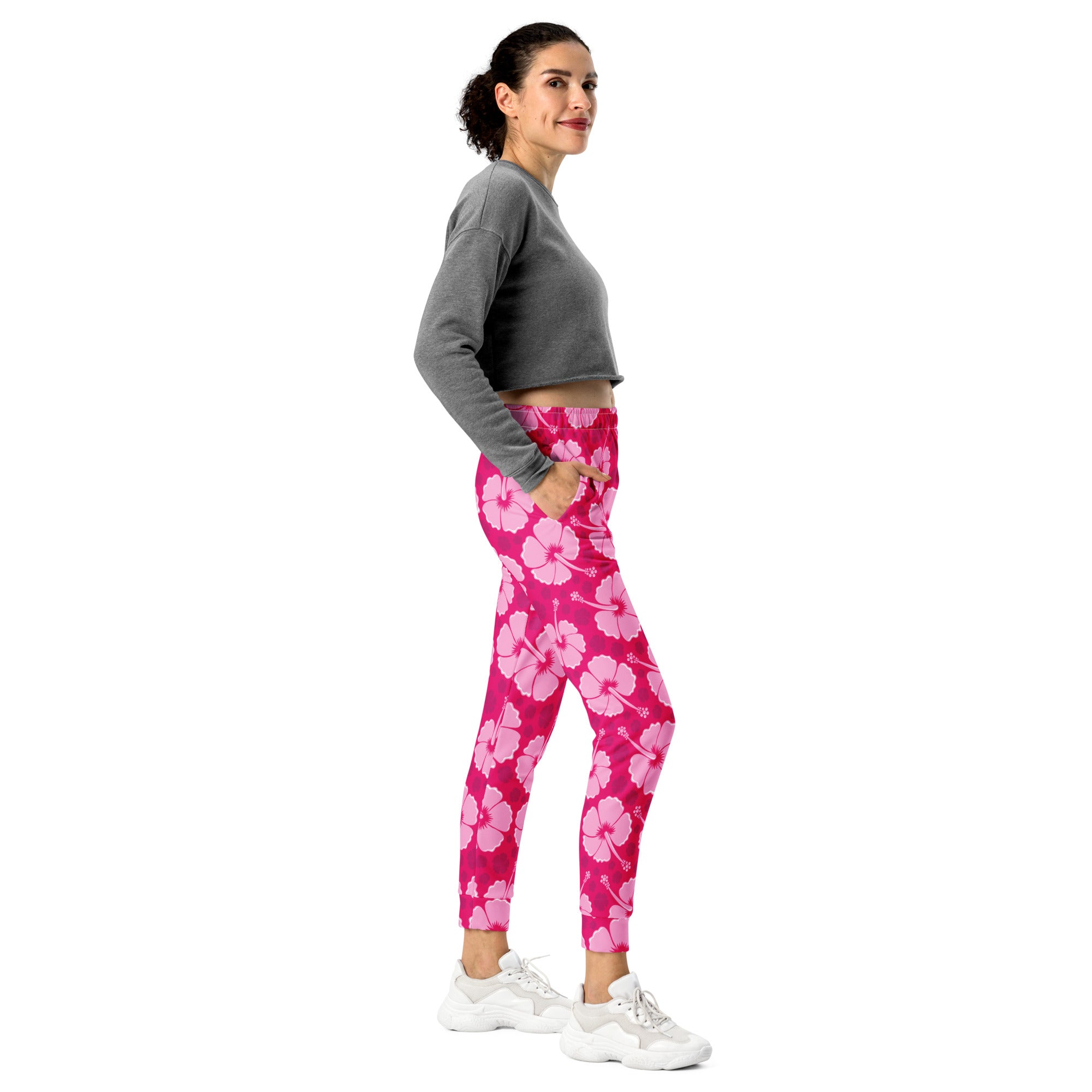 Women’s pink hibiscus floral recycled jogger pants with pockets featuring cozy brushed inside fleece and floral print