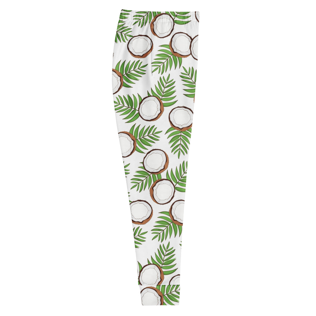 Women’s white recycled jogger pants with vibrant green palm leaves and brown coconut pattern cozy brushed fleece