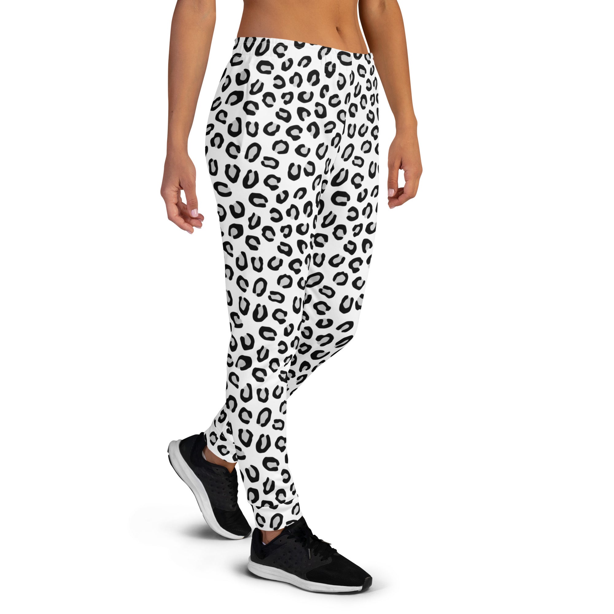 White leggings with bold black leopard print featuring cozy brushed inside fleece and pockets made from recycled materials