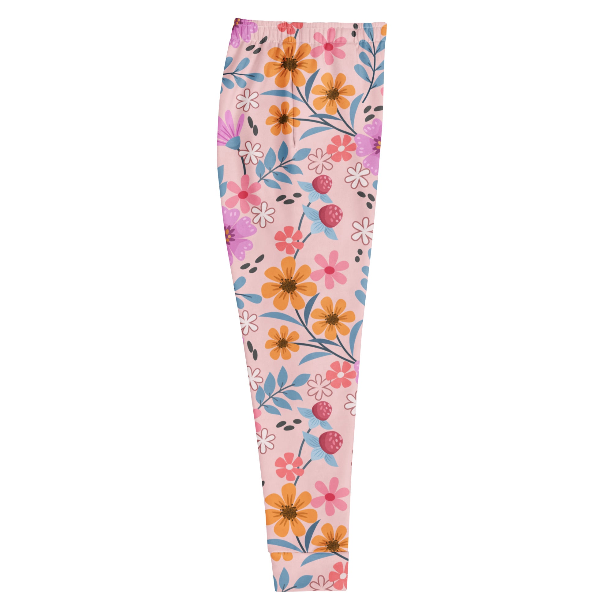 Women’s pink floral recycled jogger pants with pockets featuring vibrant orange pink purple flowers on pastel background