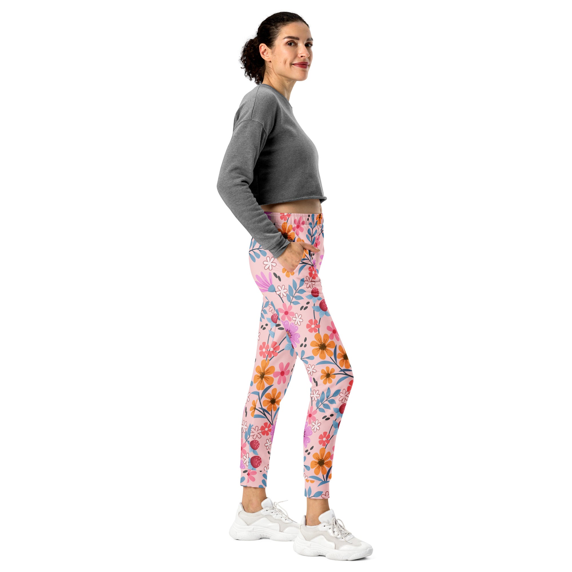 Women’s pink floral recycled jogger pants with vibrant orange blue and red flowers cozy brushed fleece inside