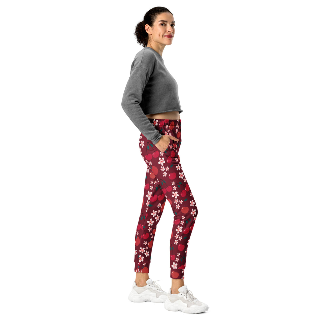 Women’s red and pink cherry blossom patterned recycled jogger pants with pockets cozy brushed fleece interior