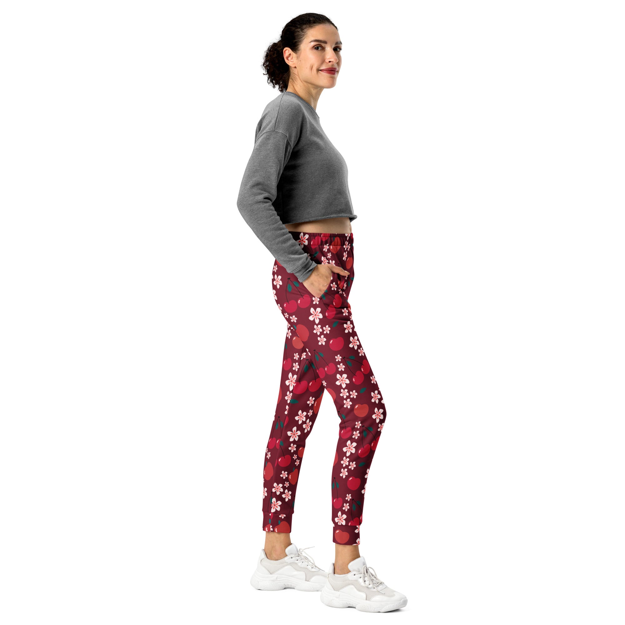 Women’s red and pink cherry blossom patterned recycled jogger pants with pockets cozy brushed fleece interior