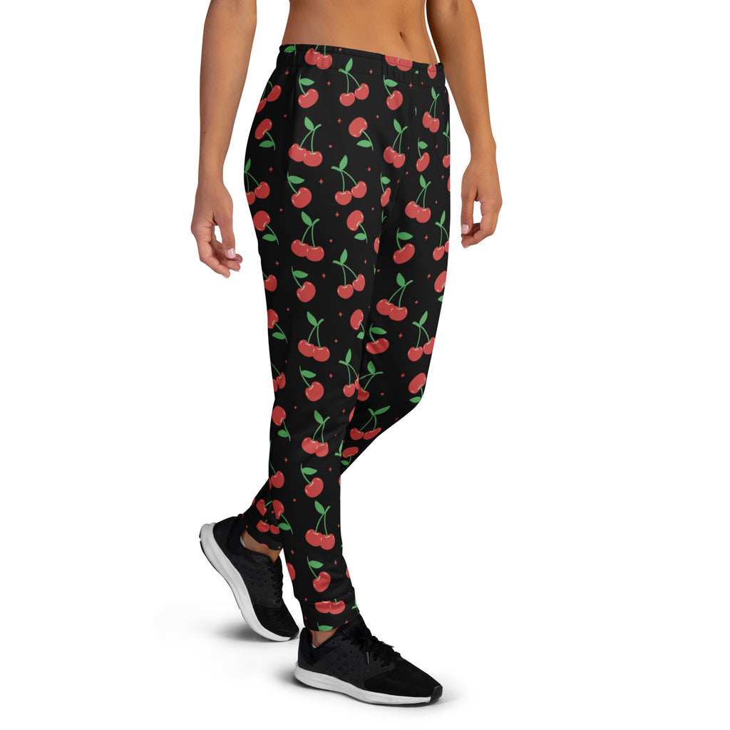 Women’s black cherry recycled jogger pants with cozy brushed fleece inside featuring red cherries and green stems pattern