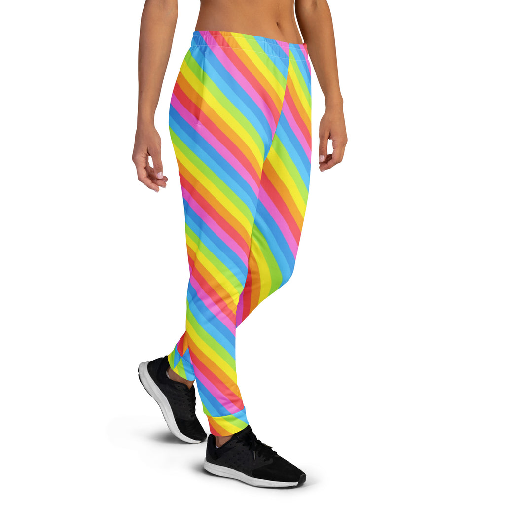 Women’s rainbow stripe recycled jogger pants with pockets in vibrant pink yellow blue and green diagonal pattern and cozy fleece lining