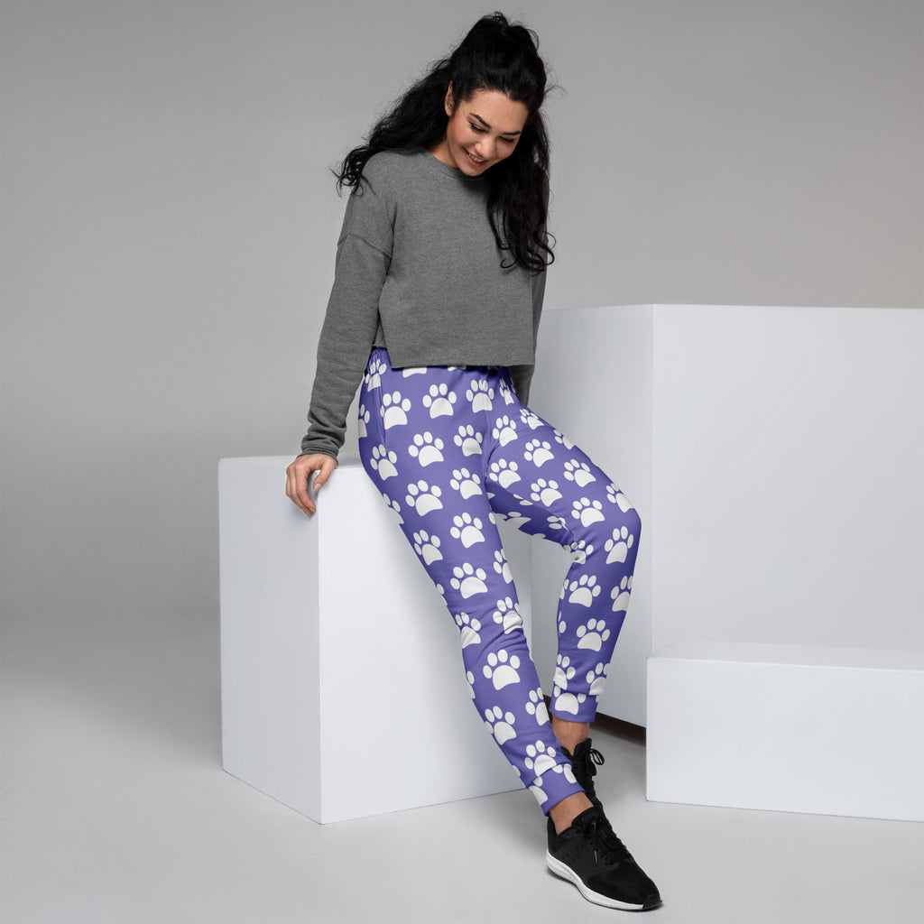 Women’s purple recycled jogger pants with white paw print pattern and cozy brushed inside fleece with pockets