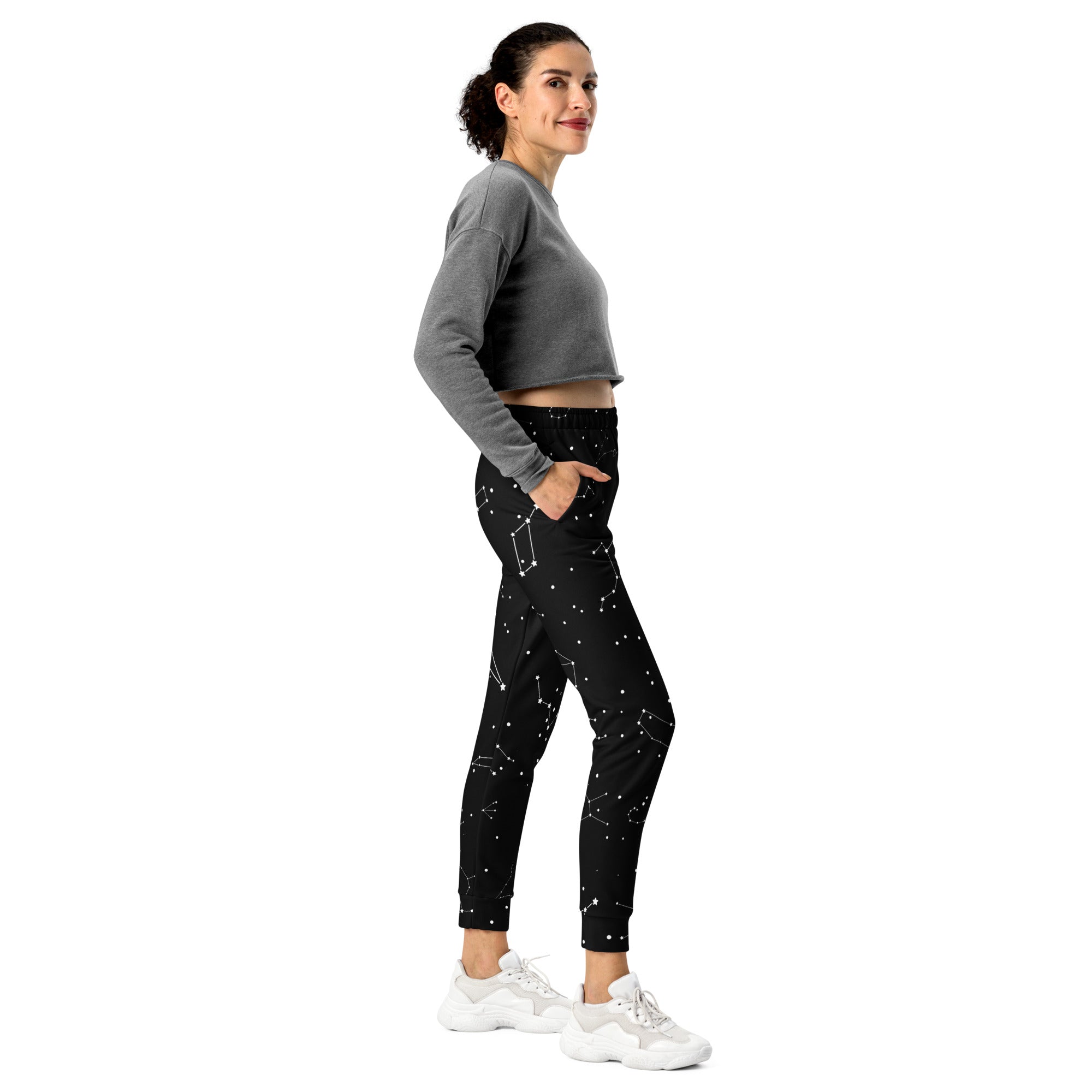 Women’s black jogger pants with starry constellation pattern made of recycled cozy brushed inside fleece with pockets