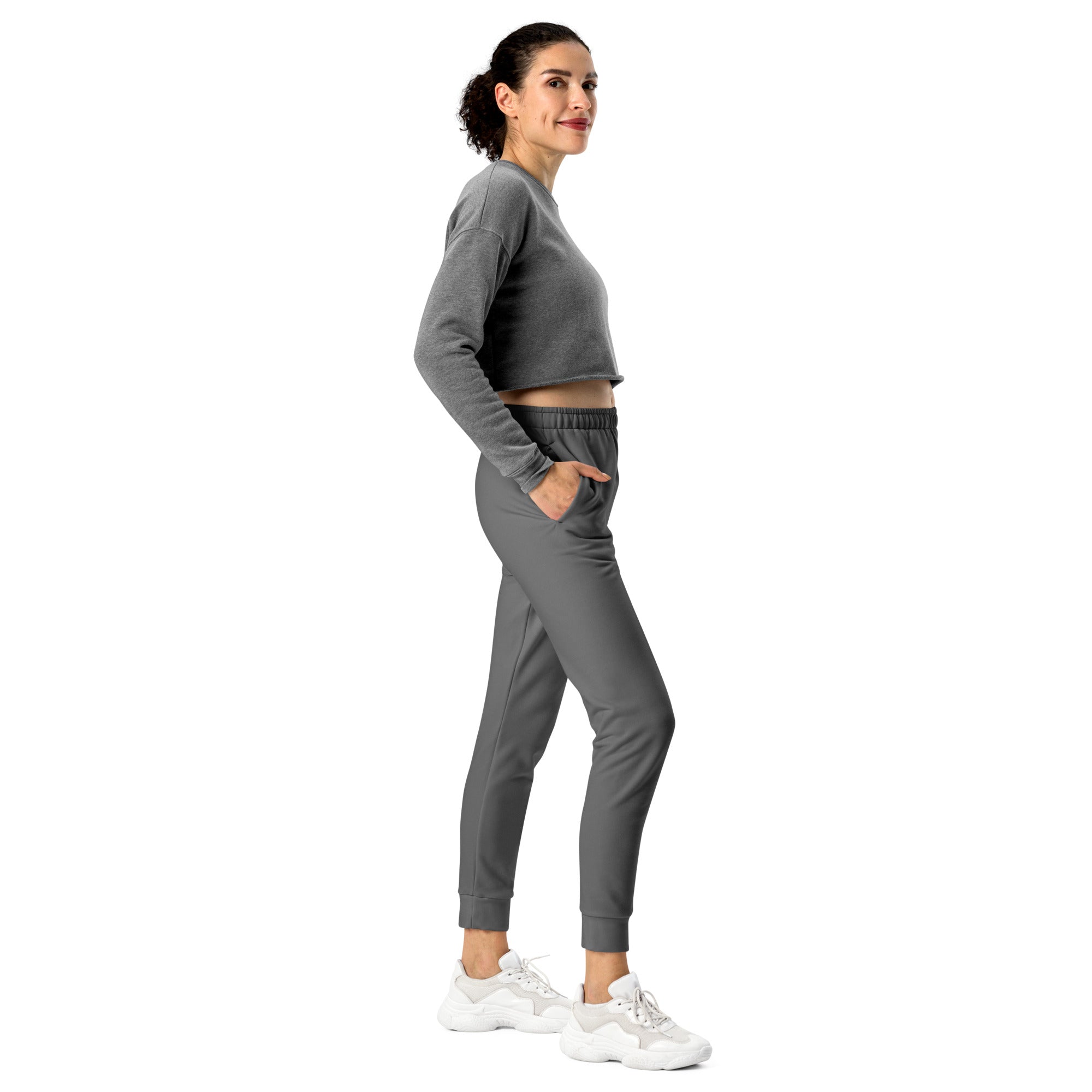 Women’s gray recycled jogger pants with pockets feature cozy brushed inside fleece and a gray cropped long-sleeve sweatshirt with elastic waistband and side pockets