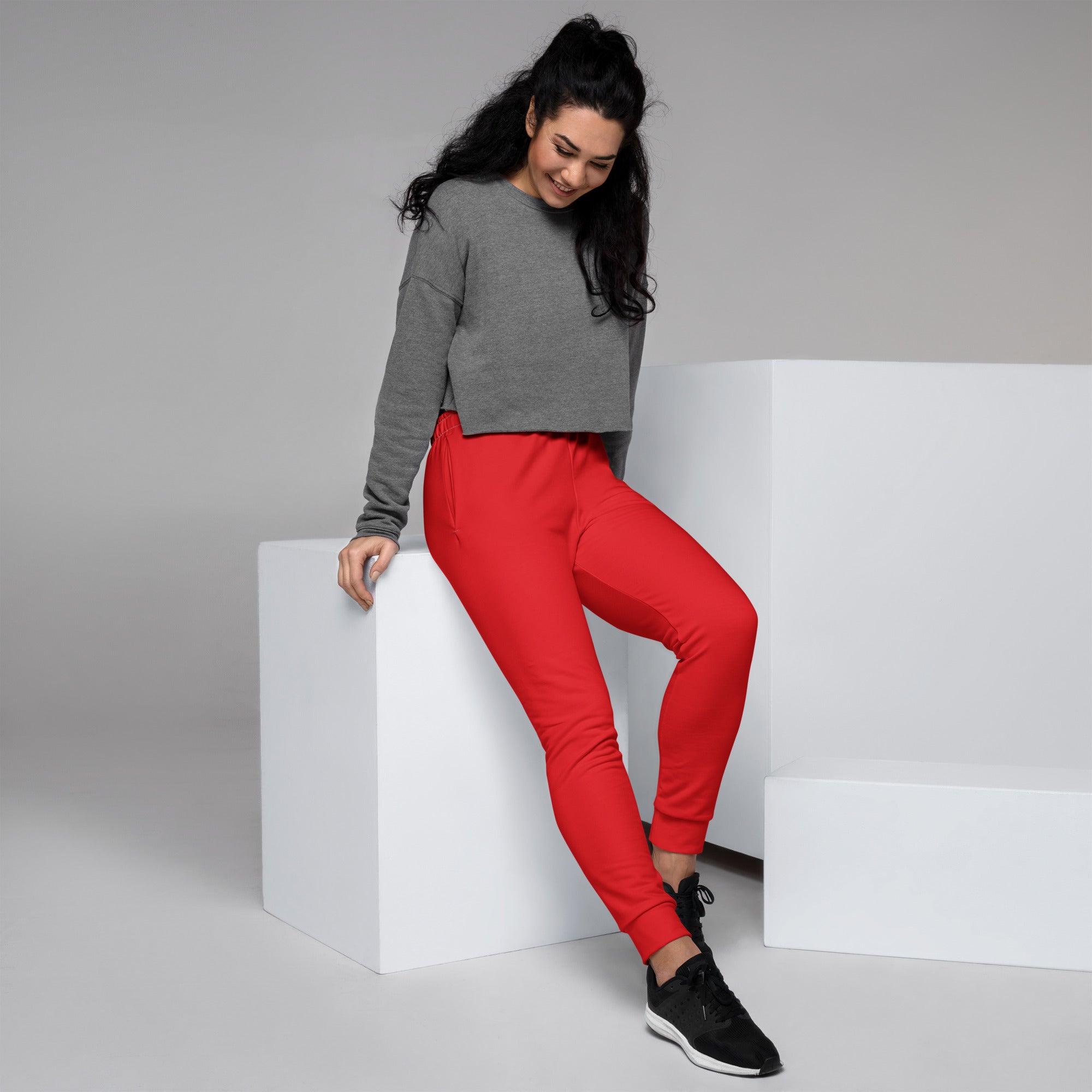 Women’s red recycled jogger pants with snug fit elastic cuffs pockets and cozy brushed inside fleece lining