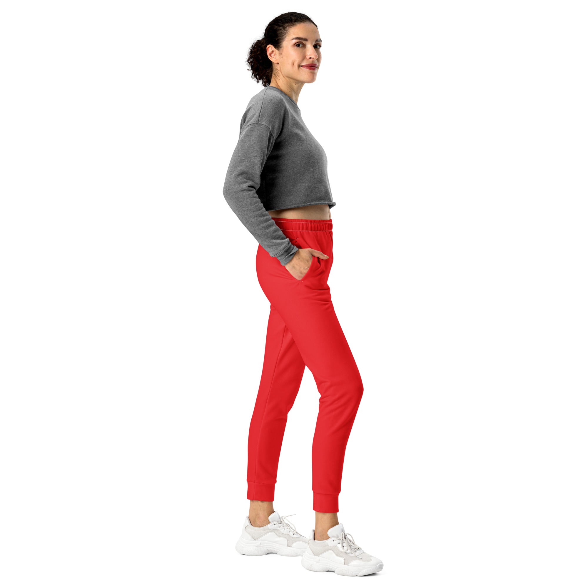 Women’s red recycled jogger pants with elastic waistband cuffed ankles pockets and cozy brushed fleece inside