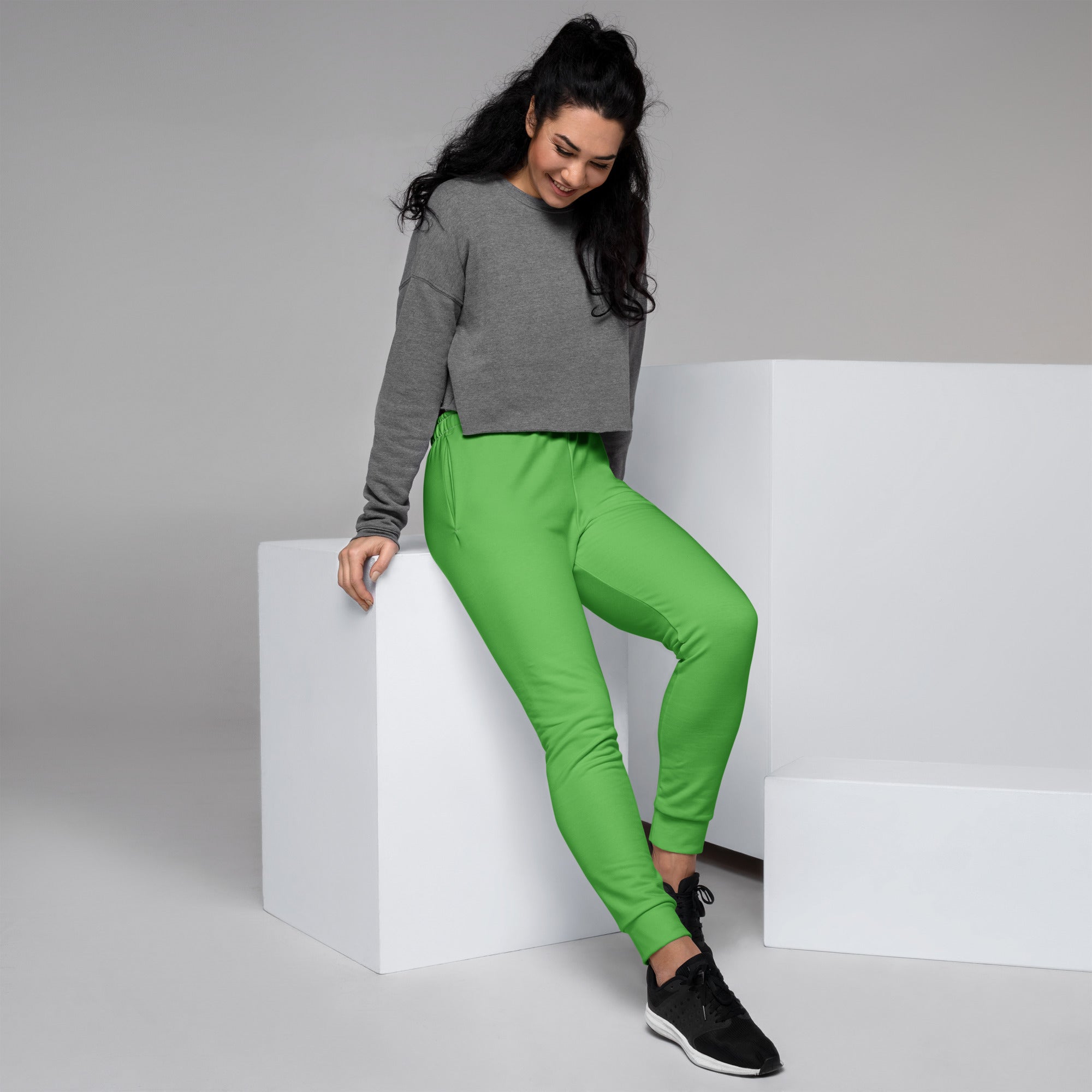 Women’s bright green recycled jogger pants with snug fit elastic cuffs and cozy brushed inside fleece lining