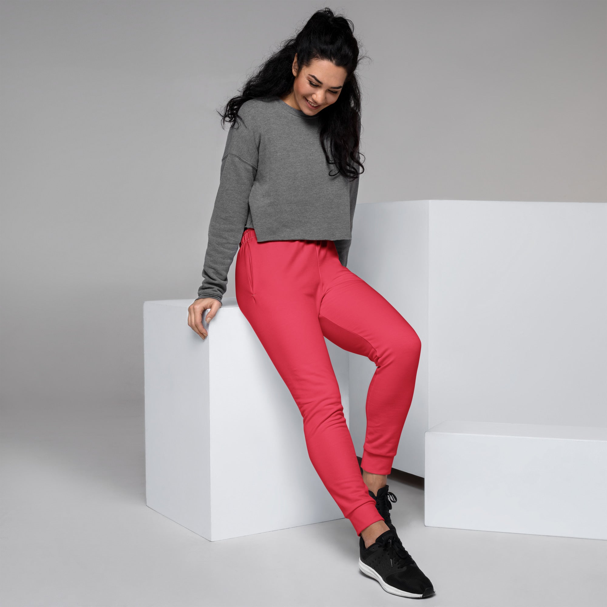 Women’s bright coral pink recycled jogger pants with snug fit ribbed cuffs cozy brushed fleece inside and pockets