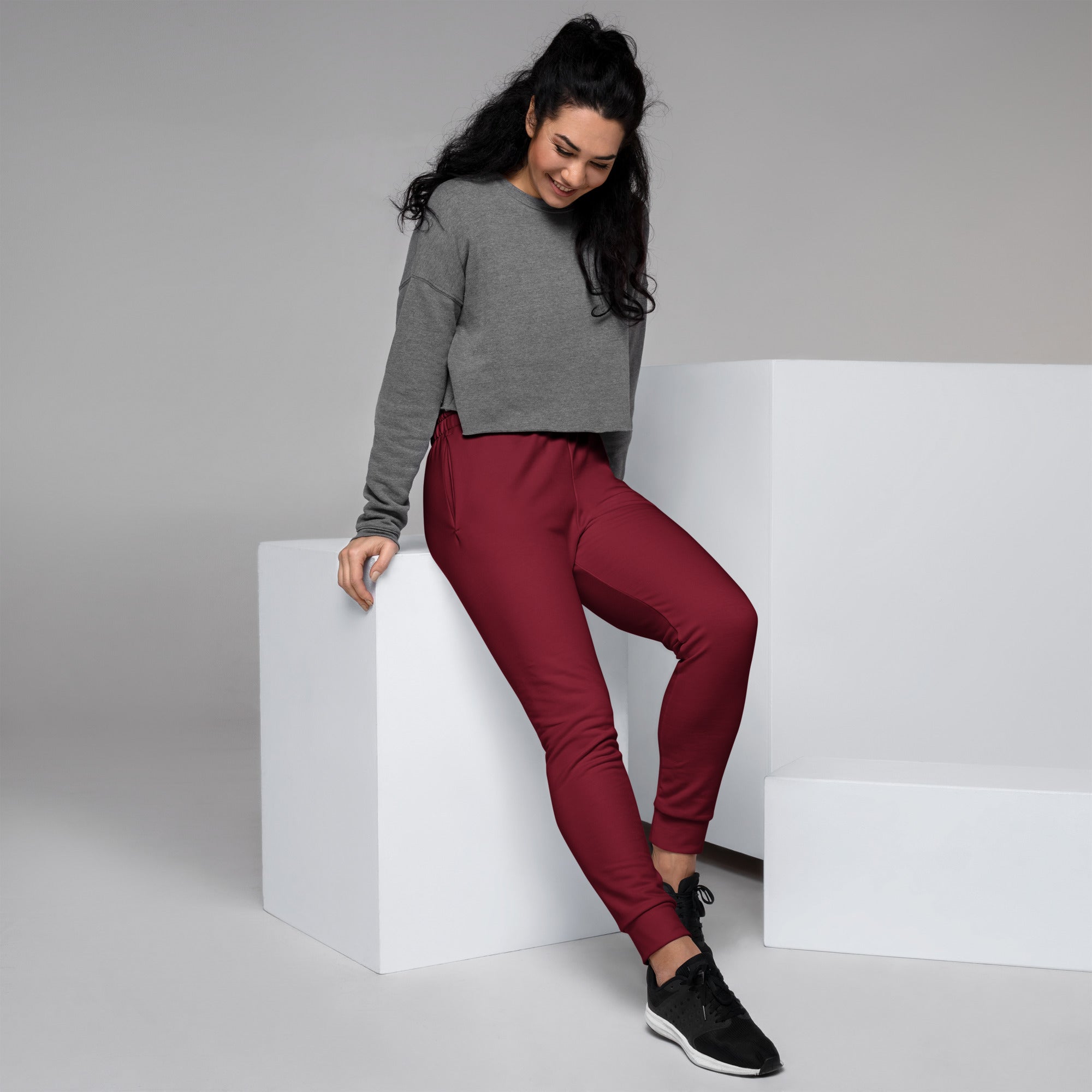 Women’s burgundy recycled jogger pants with snug fit elastic cuffs pockets and cozy brushed inside fleece lining