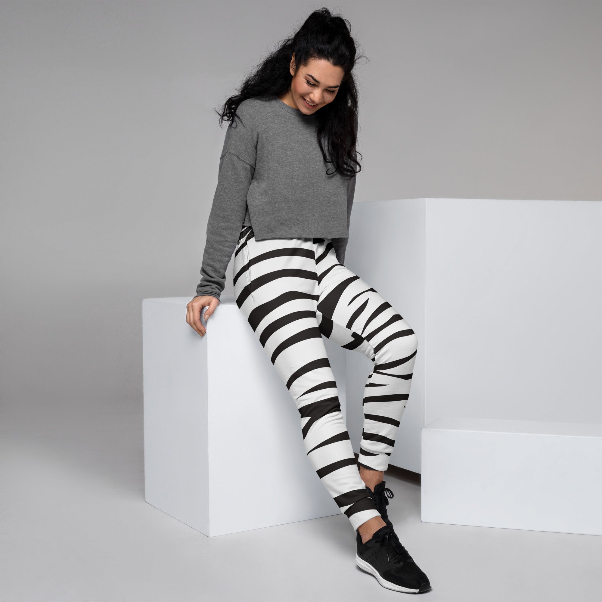 Women’s black and white zebra print recycled jogger pants with pockets and cozy brushed inside fleece lining