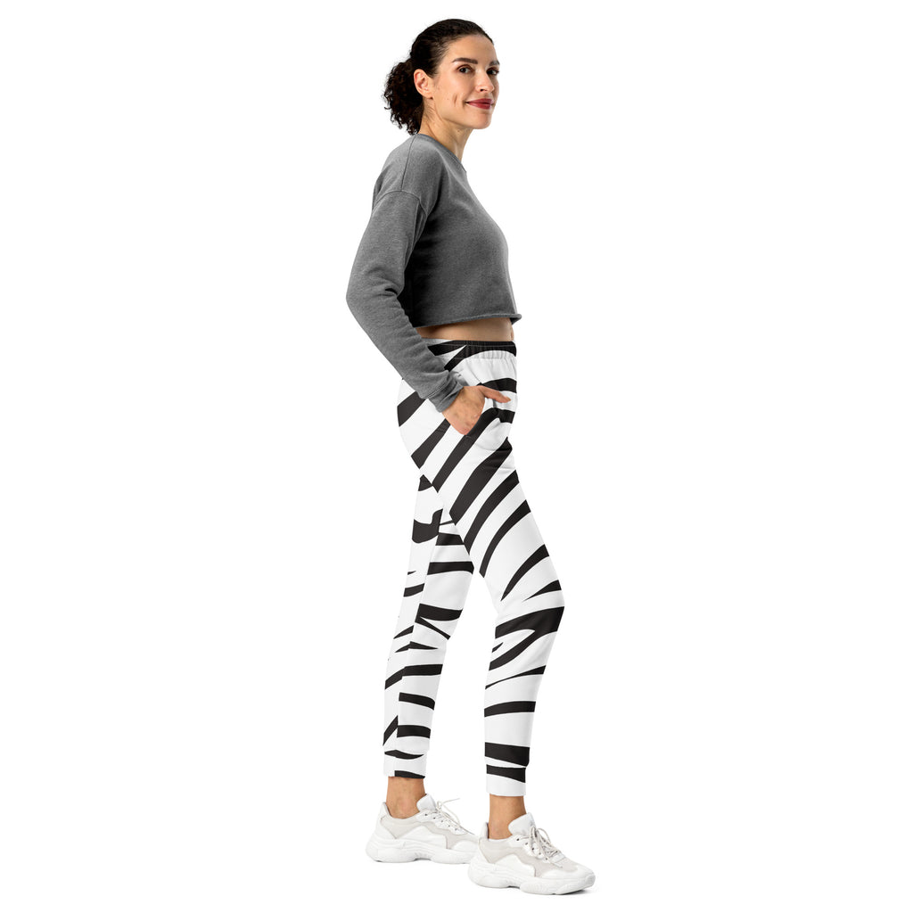 Women’s zebra print recycled jogger pants with pockets featuring black and white zebra-striped snug fleece lining