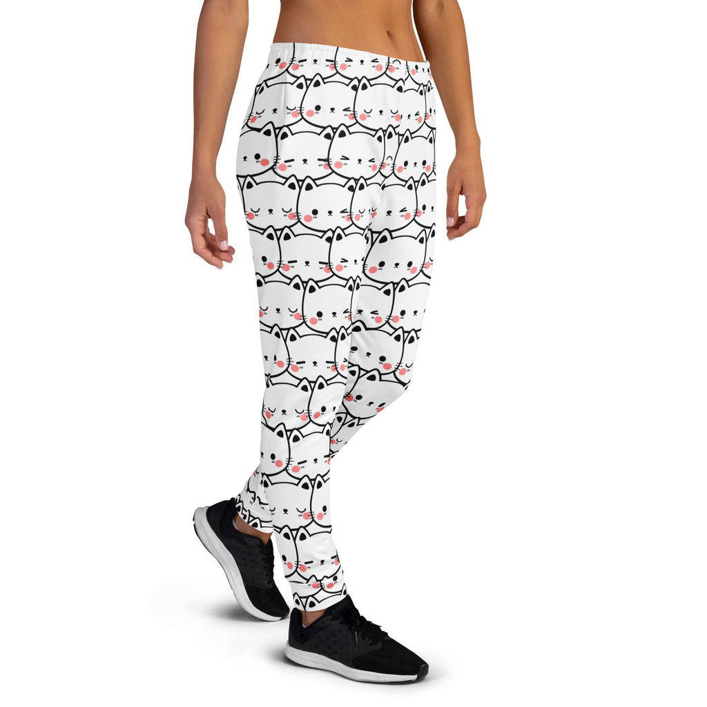 White women’s jogger pants with black-outlined cartoon cats and pink cheeks cozy brushed inside fleece pockets