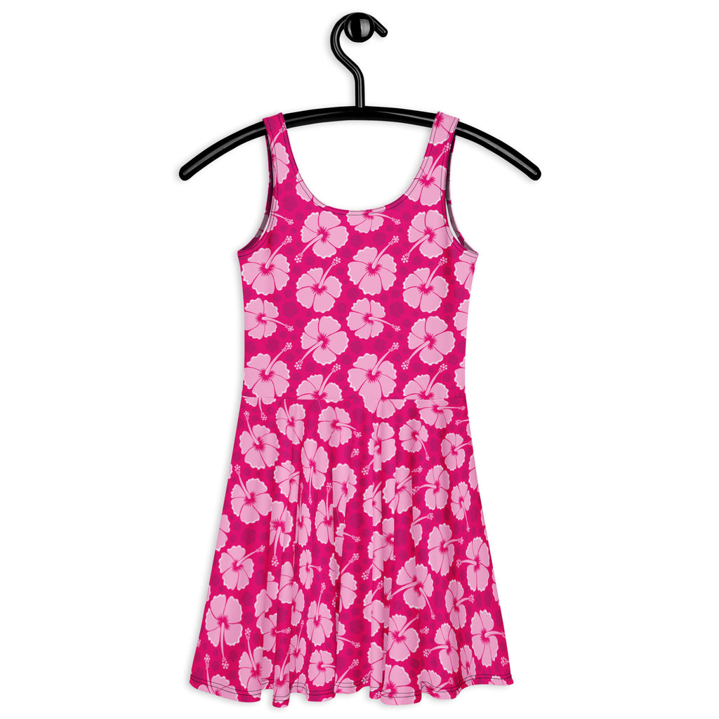 A vibrant pink sleeveless tropical skater dress with white hibiscus pattern and buttery soft fabric with UPF 50+ protection