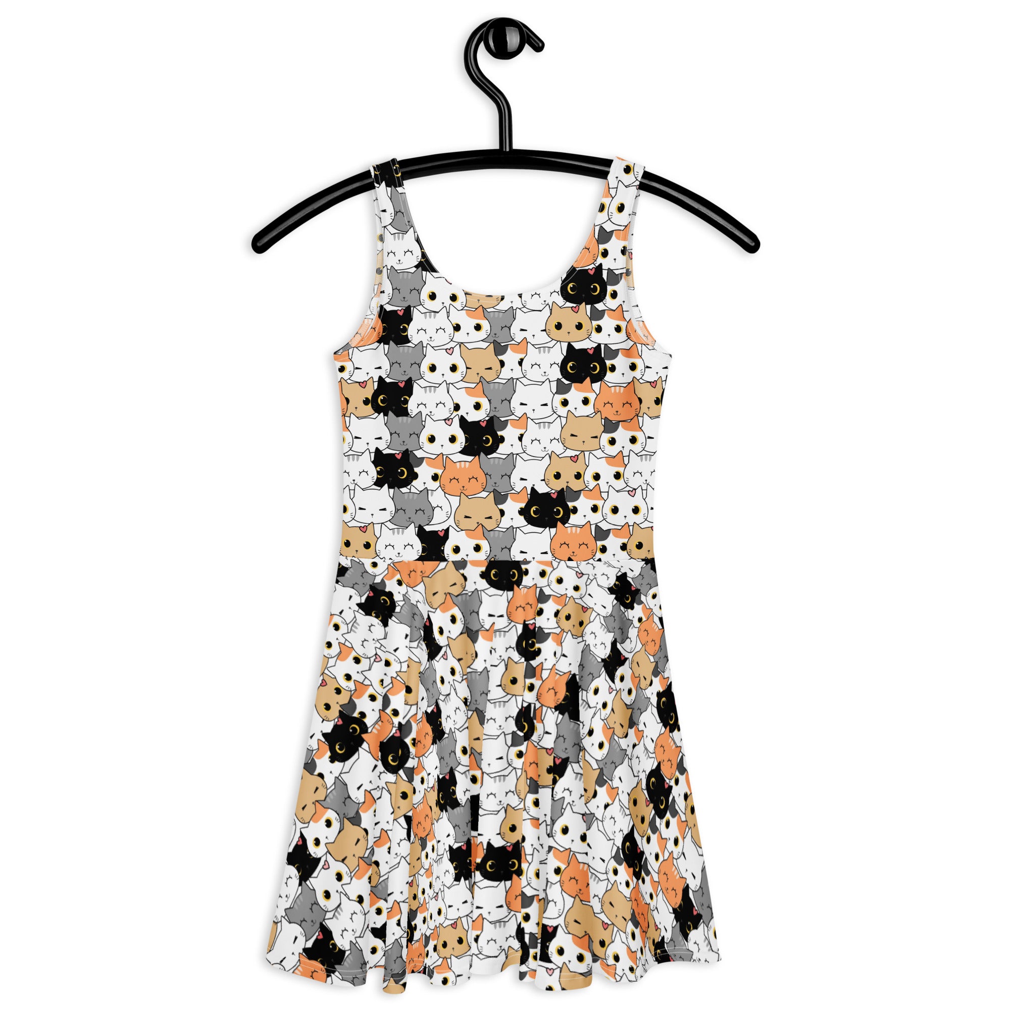 White sleeveless buttery soft skater dress with playful black orange gray and white cartoon cat face pattern and upf 50+