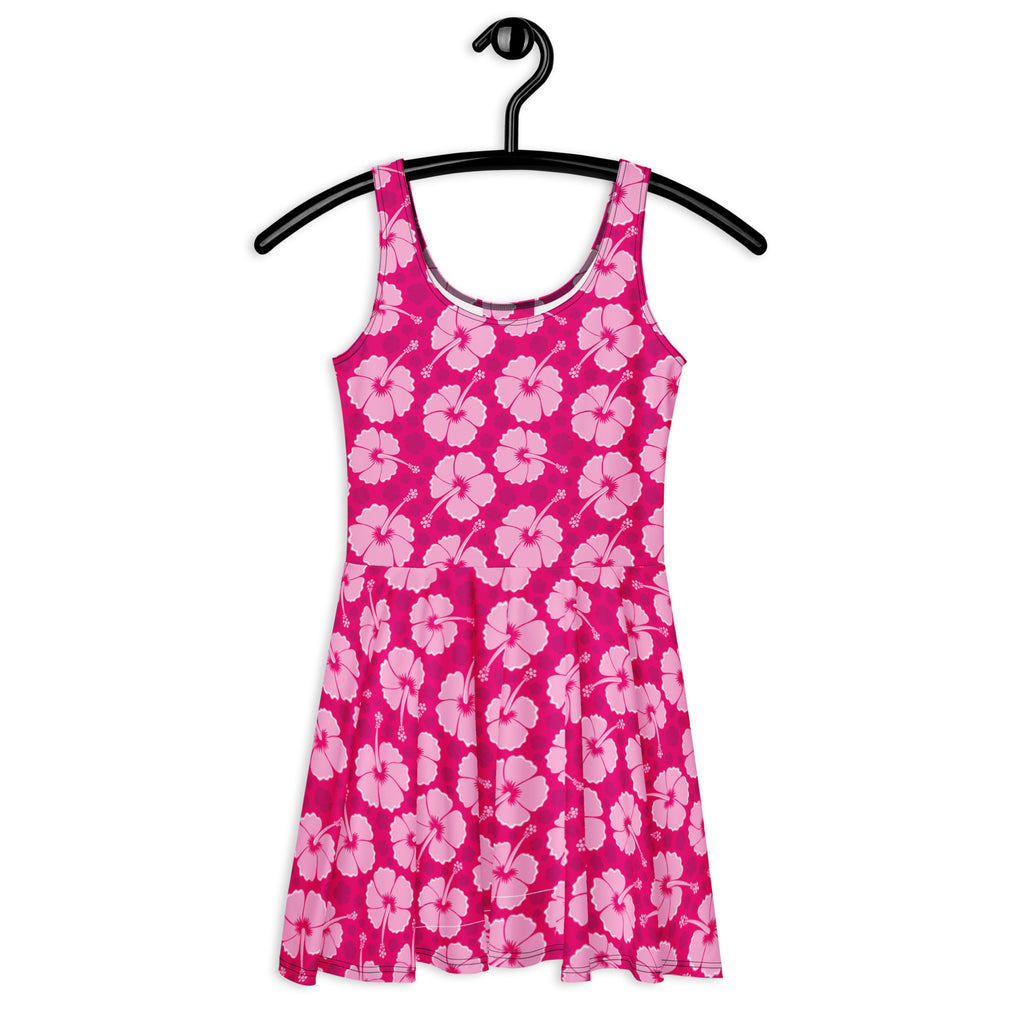 Women’s tropical pink hibiscus buttery soft skater dress with upf 50 plus featuring a vibrant floral pattern on a black hanger