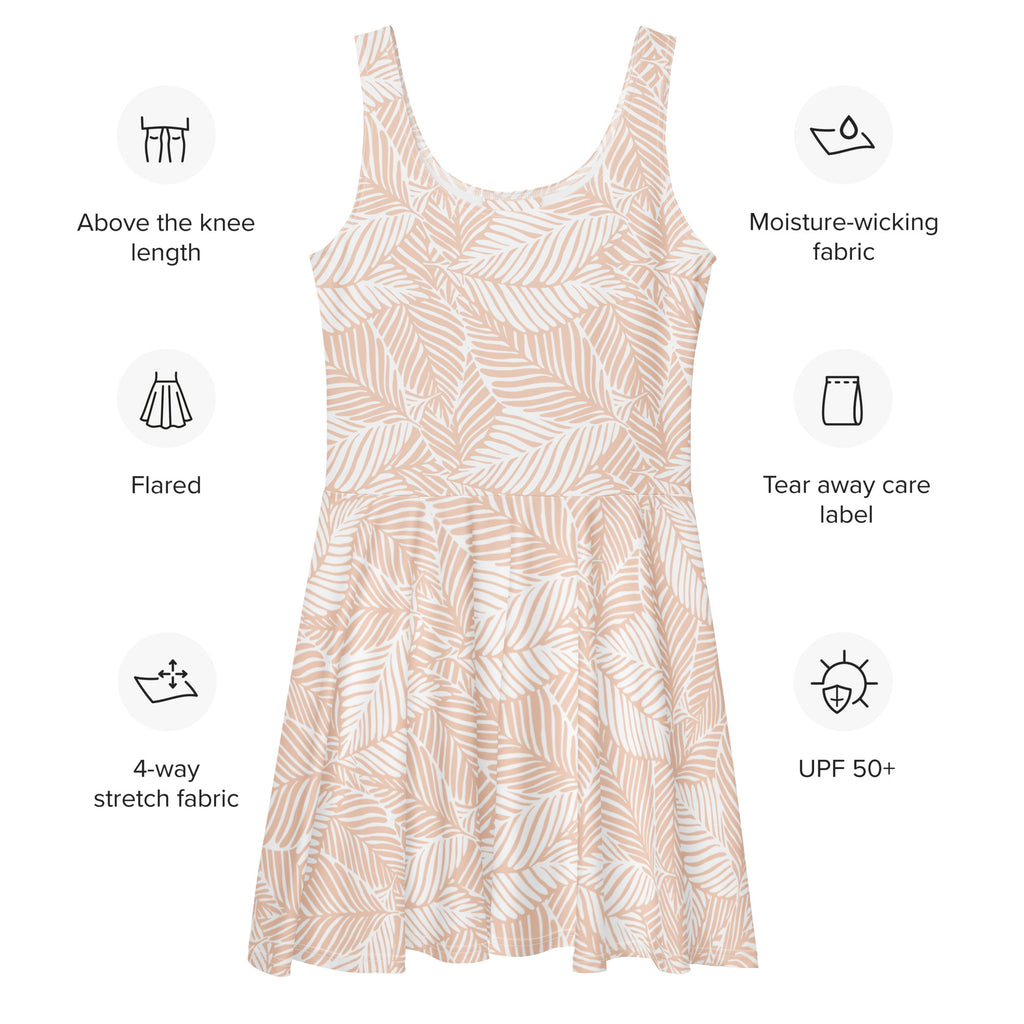 A soft blush-colored sleeveless skater dress with delicate leaf print made from buttery soft fabric and UPF 50 plus protection